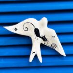 andorinha em ceramica padrão gato