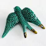 andorinha em cerâmica na cor verde