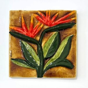 azulejo alto relevo flor estrelicia vermelha com fundo castanho